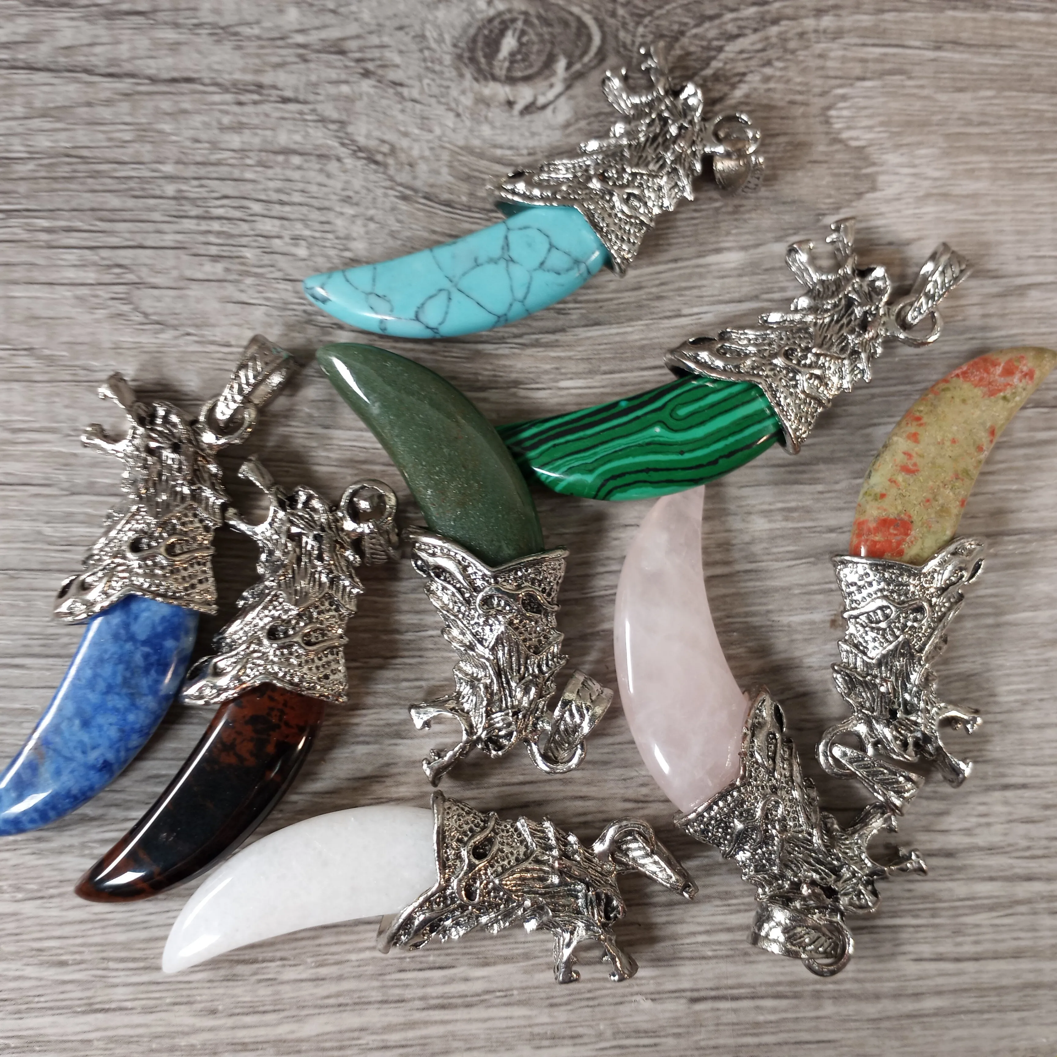 Hand-Carved Gemstone Wolf Head Pendant – Assorted Stones
